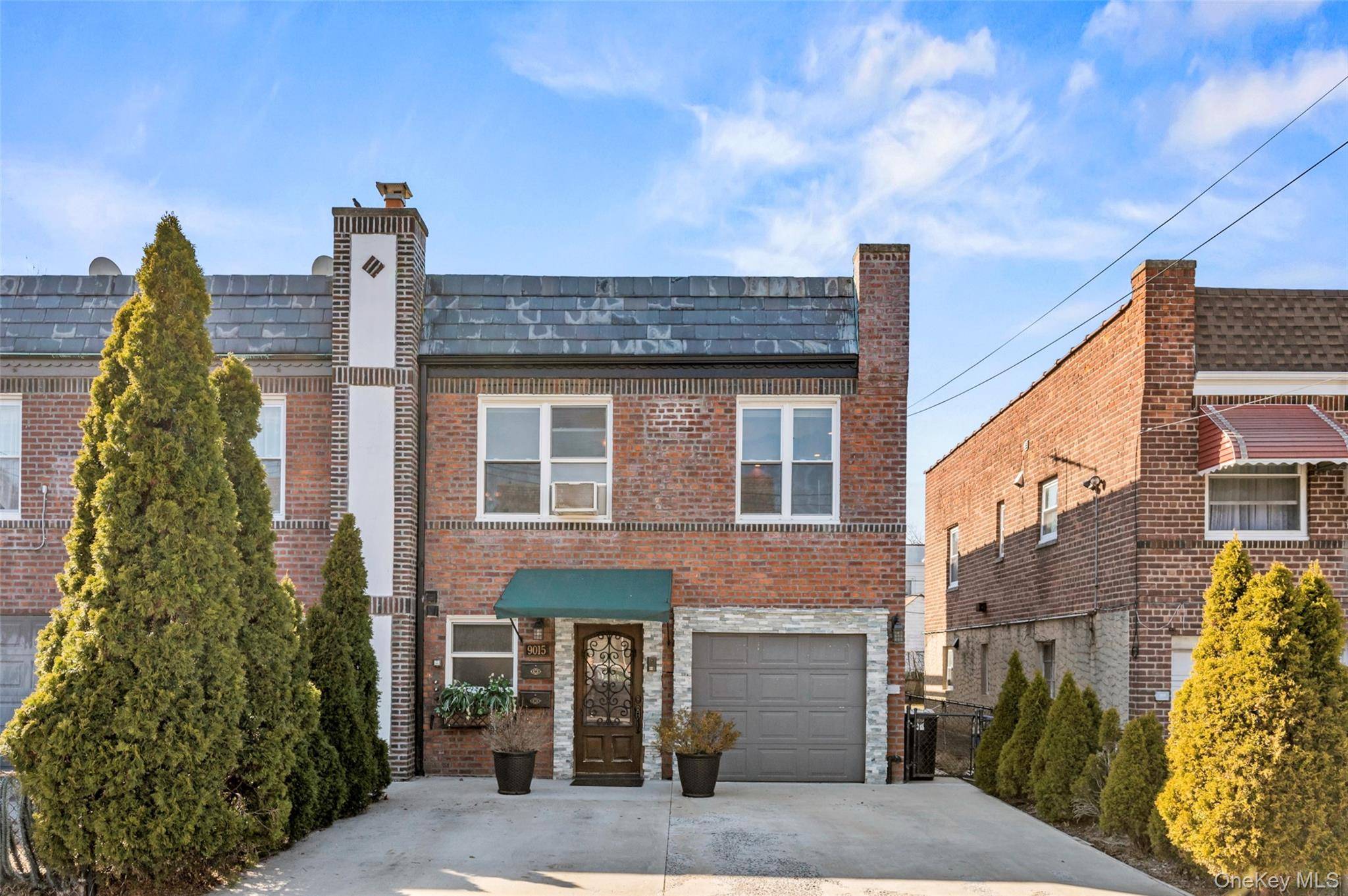 Beautiful 2 family solid brick semi detached townhouse located in the heart of Forest Hills, perfect for multi generational living or as an investment property.