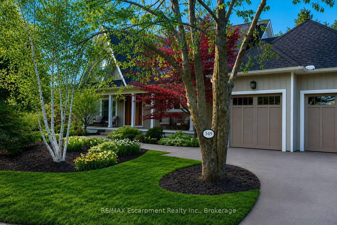 Surrounded by mature trees and lush landscaping, this beautifully updated 4 bedroom South Oakville home offers rare privacy, timeless character, and elegant living throughout.