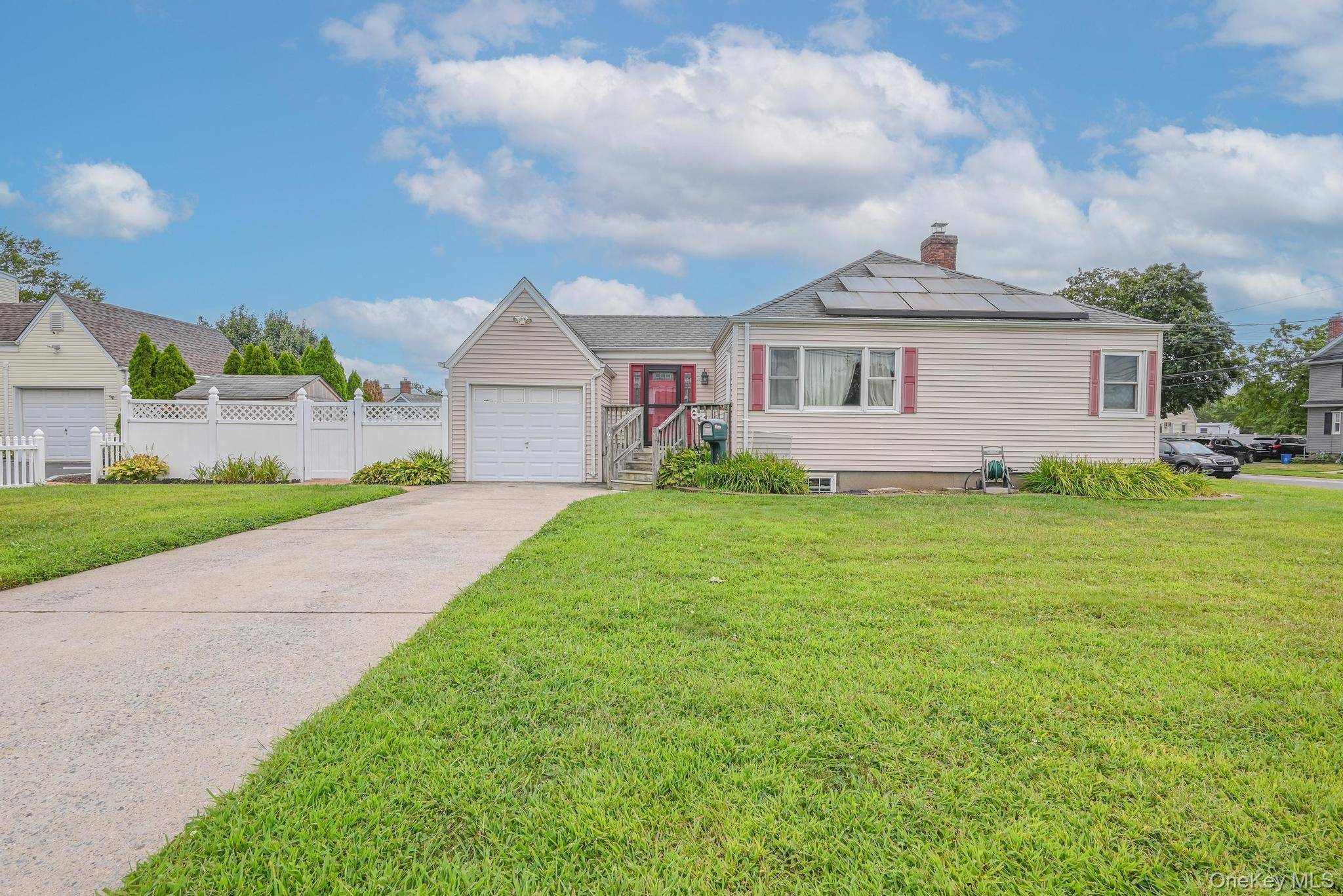 Cozy ranch in the heart of Farmingdale featuring 3 bedrooms and 2 full bathrooms.