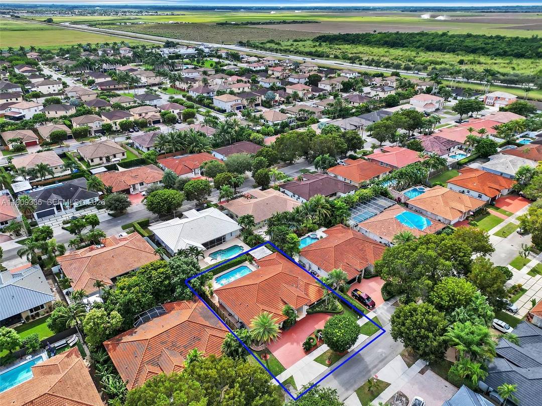 Experience modern elegance in this impeccably maintained Hammocks residence with no HOA.
