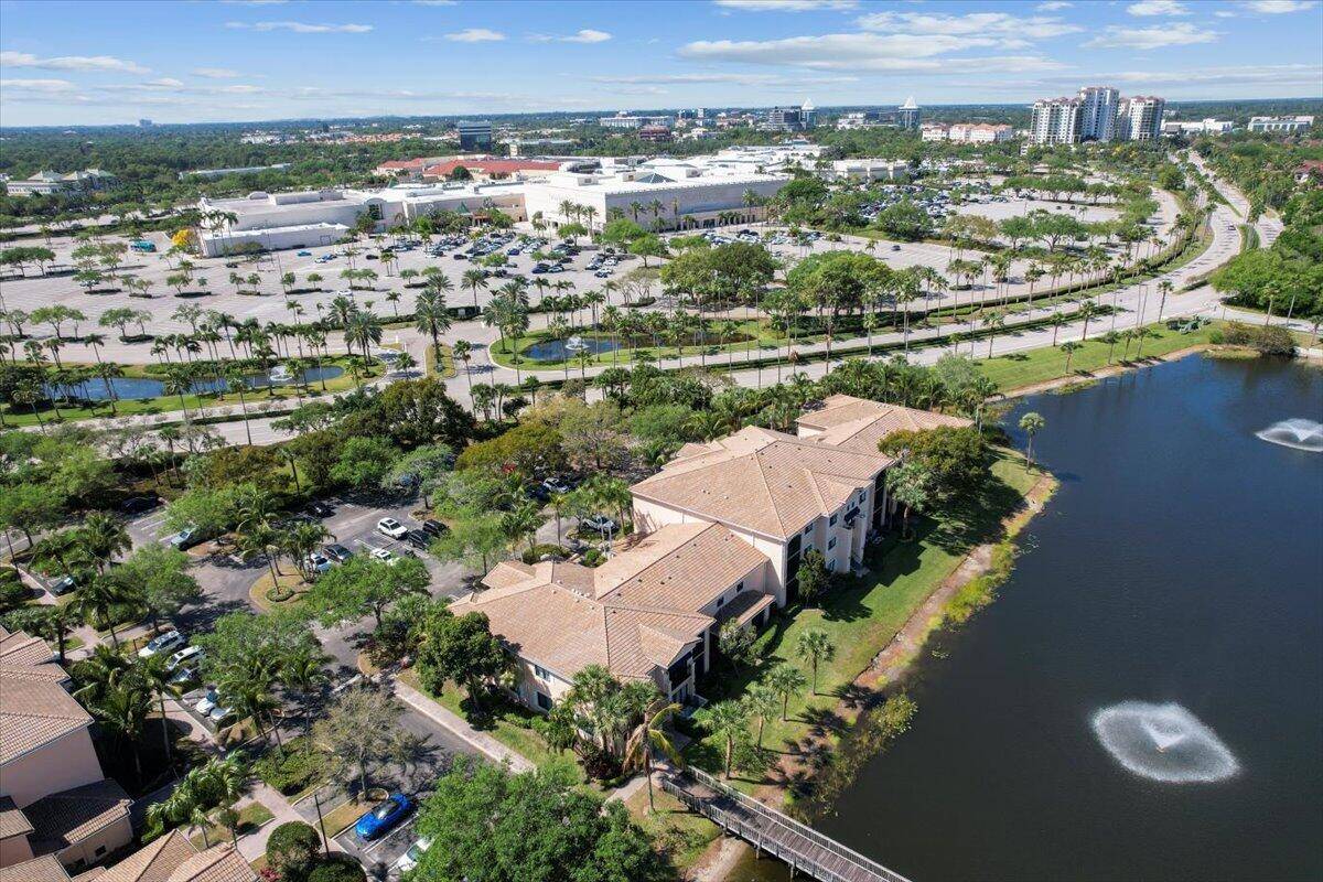 Rare 3 bed, 3 bath townhome style condo in San Matera's most desirable building with stunning lake views !