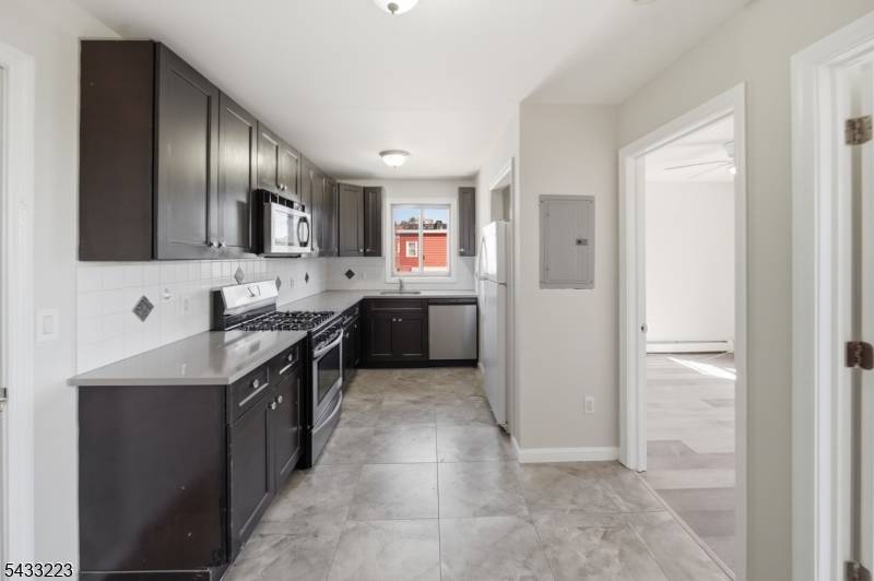 Six Residential Units, total of 24 rooms, 11 bedrooms, 6 full bathrooms.