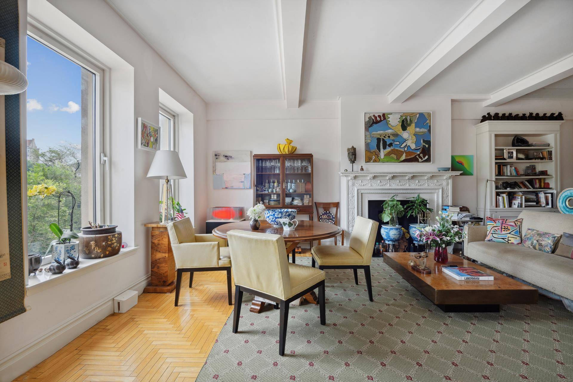 Welcome to Residence 4B at 100 Central Park South A rare offering, this gracious half floor condominium boasts breathtaking, direct views of Central Park through oversized picture windows.