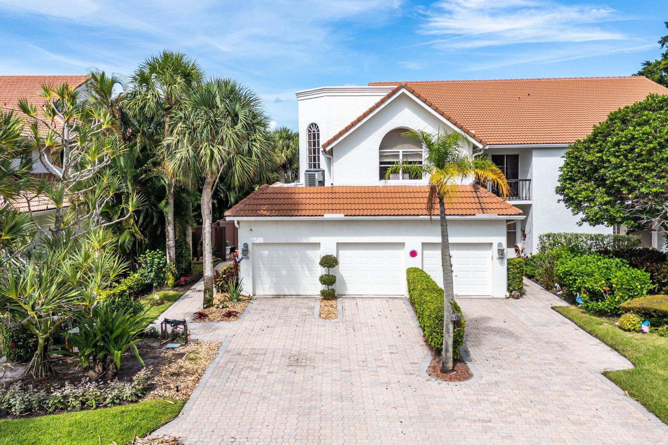 Experience modern elegance in this 4 bedroom, 3 bath condo with a 2 car garage in the award winning Broken Sound Club.