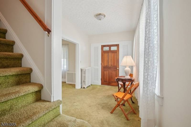 Opportunity awaits in this classic Colonial ready for additional updates improvements on street with nicely renovated expanded homes.
