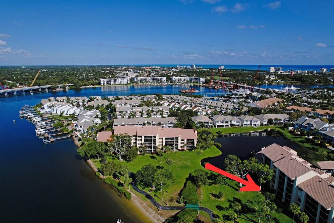 Rarely available and truly turnkey, this first floor residence in the sought after Jupiter Harbour community offers serene Intracoastal views and the best of waterfront living.