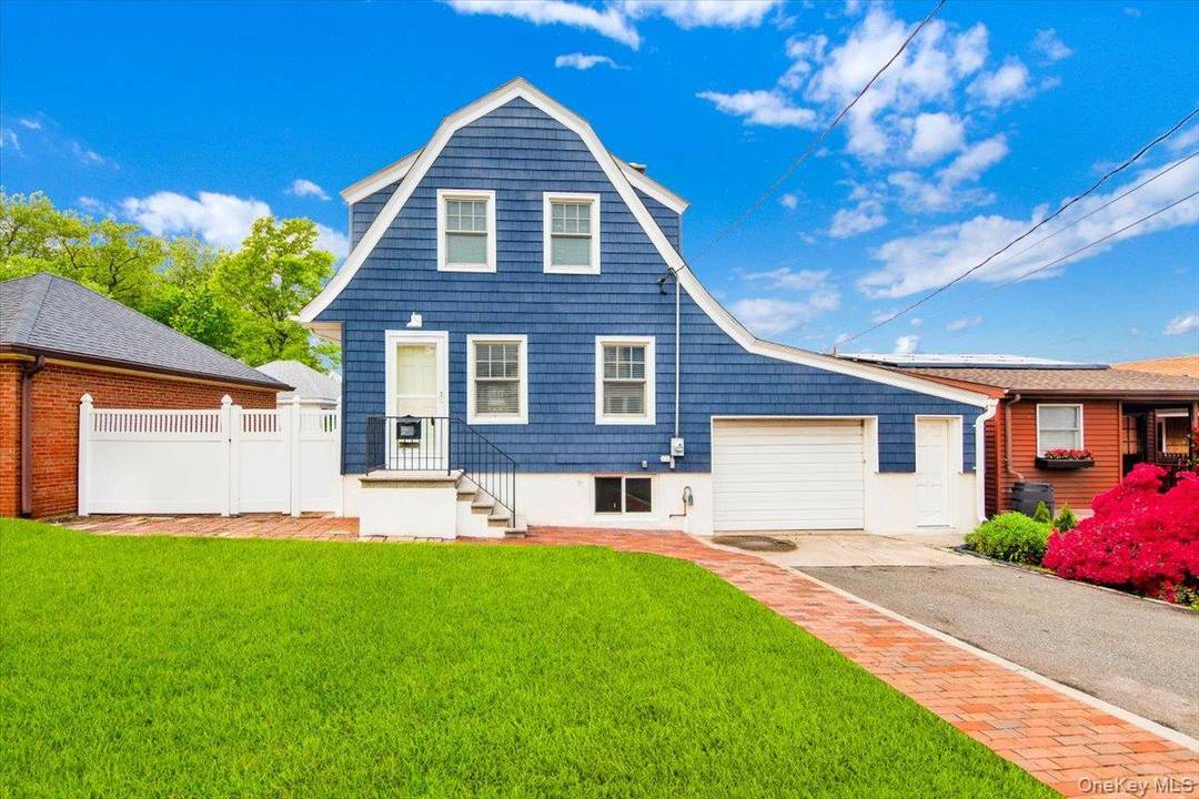 Live the City Island dream in this beautifully renovated classic Dutch Colonial home.