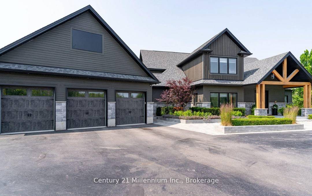 Welcome to 6920 Poplar Side Road, a stunning custom built estate on nearly 1.