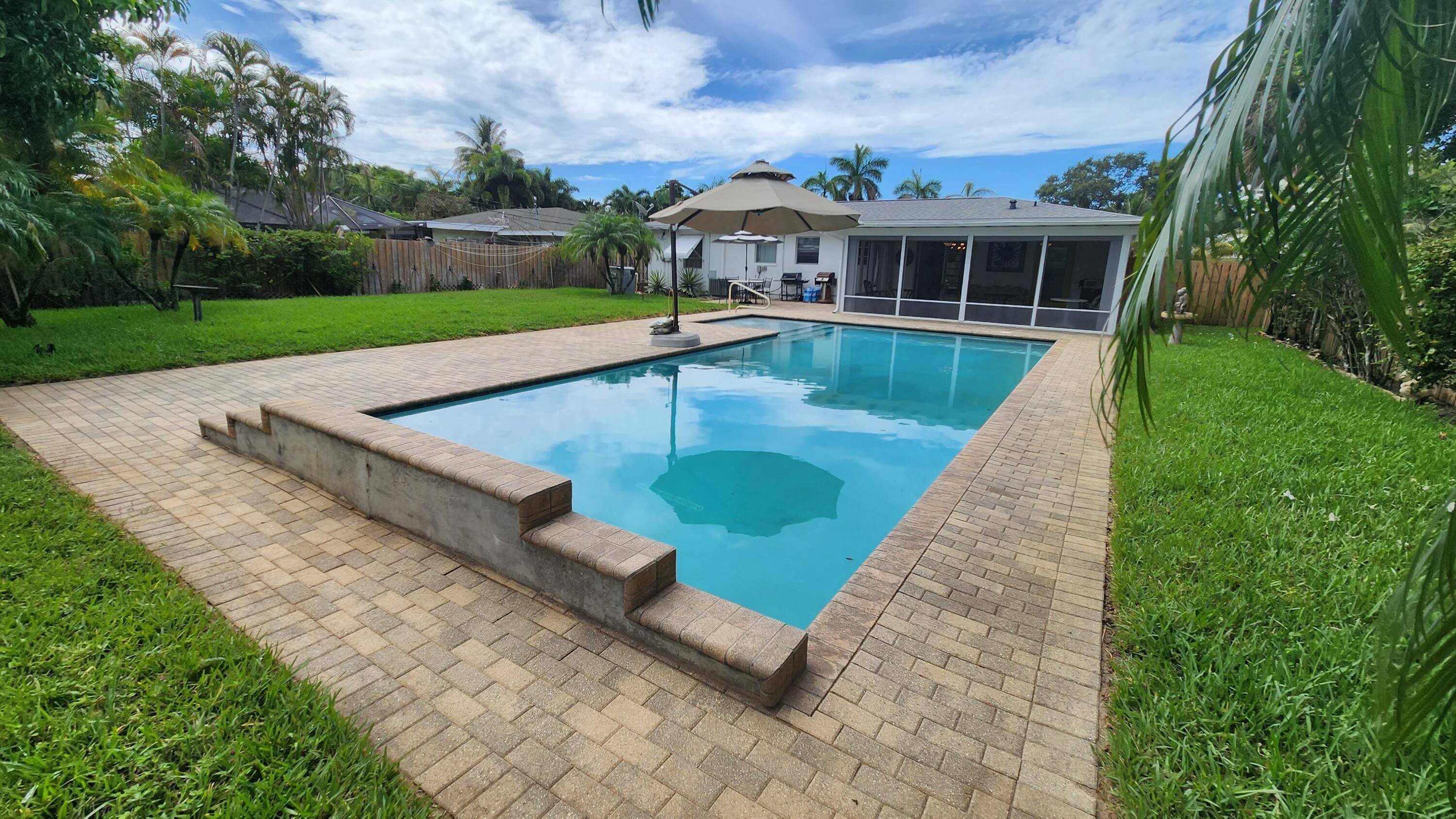 Impeccably maintained 2 BR 2 BA home w nearly 1 4AC private oasis heated pool w shelf bubblers, fenced yard, tons of room to entertain.