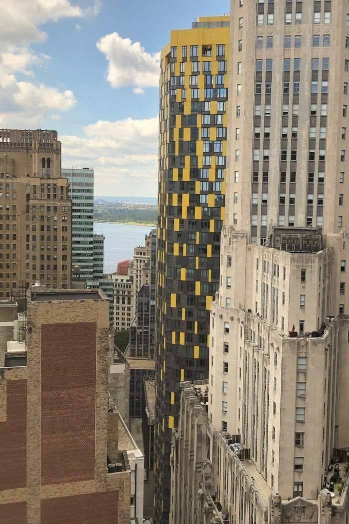 Motivated Seller Step into this bright and airy studio, where natural light pours in through oversized windows, framing stunning views of the Financial District and the East River.