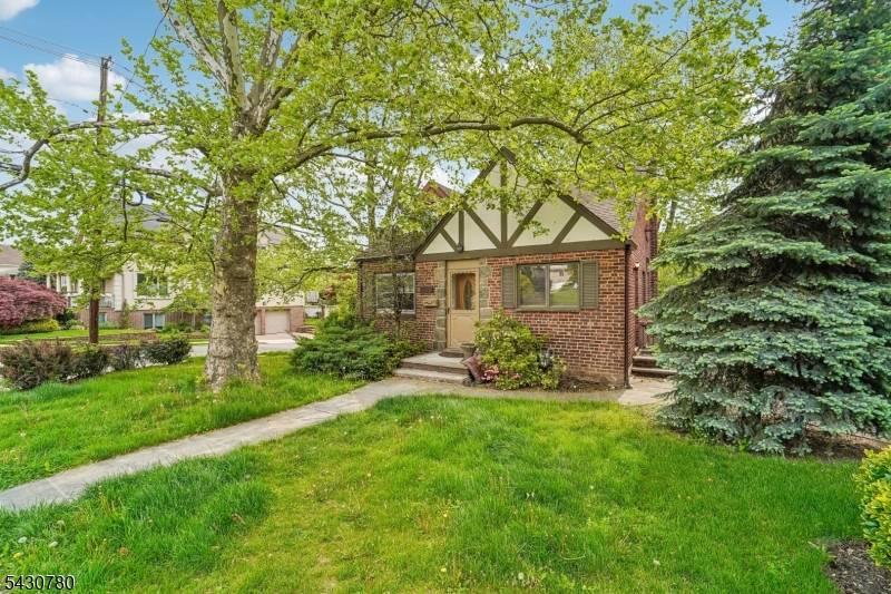 This single family home, in a Medieval Revival style, is located in Fort Lee, just minutes from New York City.