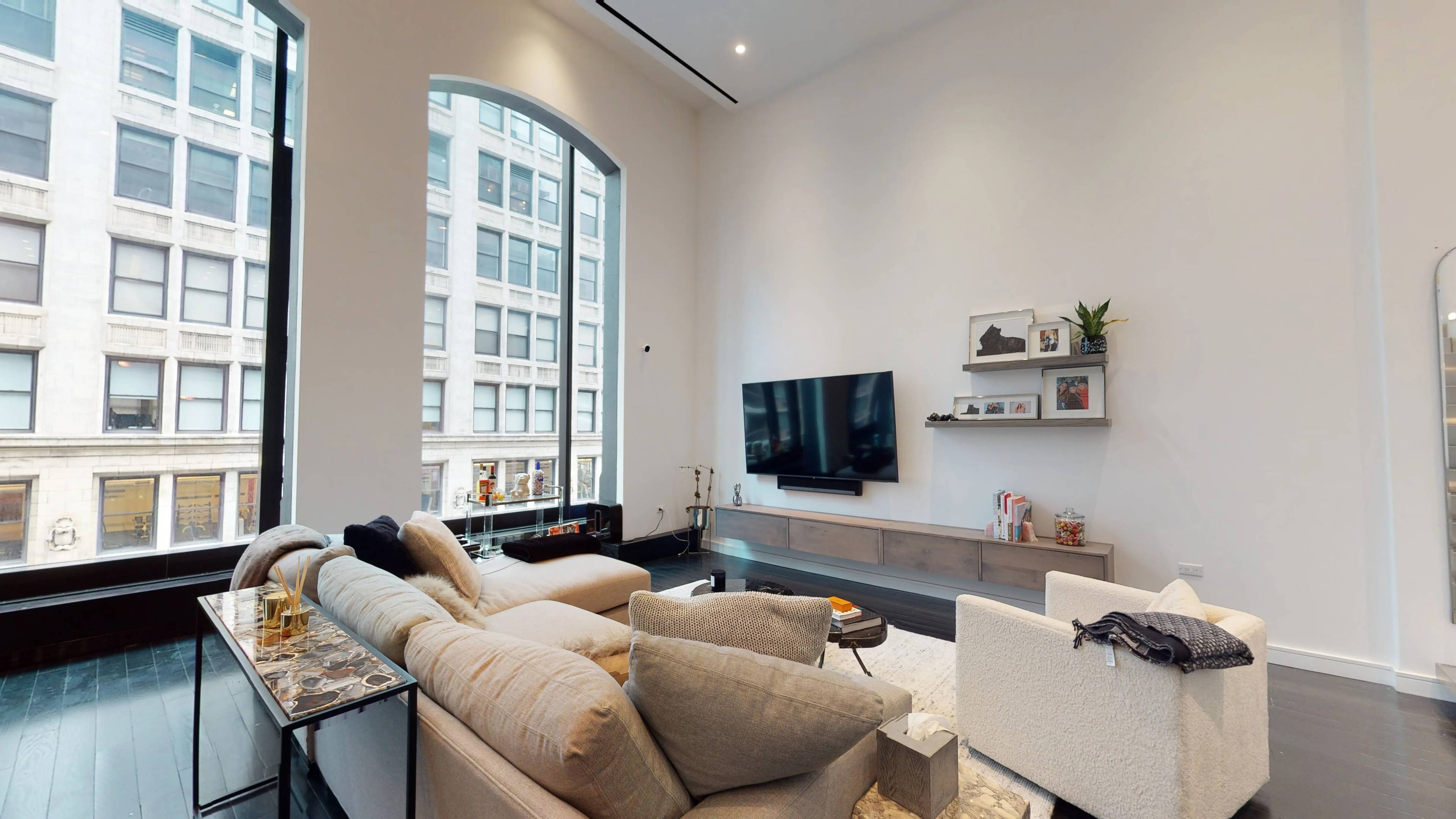 Stunning double height ceilings of 16 feet and matching arched windows, original Tiffany's amp ; Co headquarters feature, create a truly amazing space open, airy, bright loft.