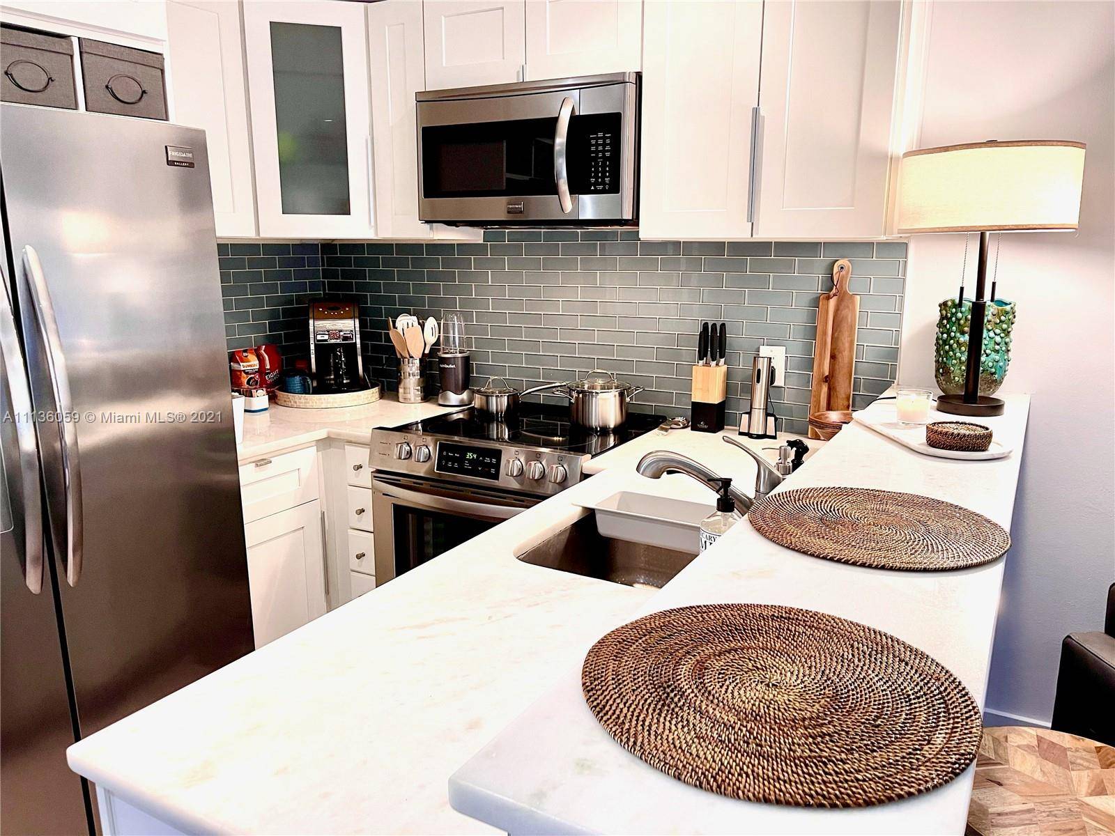 Ultra modern completely remodeled, newly luxuriously furnished, 1BR 1BA with private patio and huge real grass fenced yard !