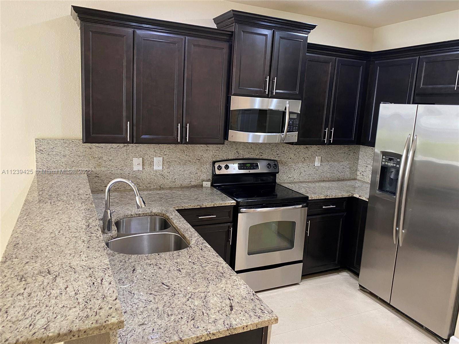 Beautiful townhouse 4 bedrooms 3 baths in the gated community Grand Bay Estates.