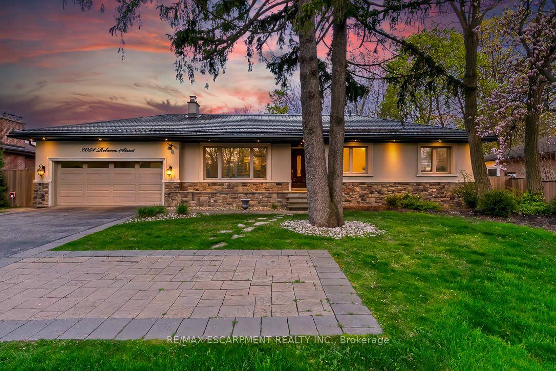 Welcome to this gorgeous luxurious bungalow located on a desirable tree lined street, in beautiful West Oakville.
