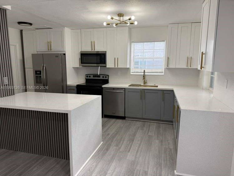 BEAUTIFULLY RENOVATED 4 BEDROOM, 2 BATH HOME FEATURING STYLISH MODERN UPGRADES THROUGHOUT.