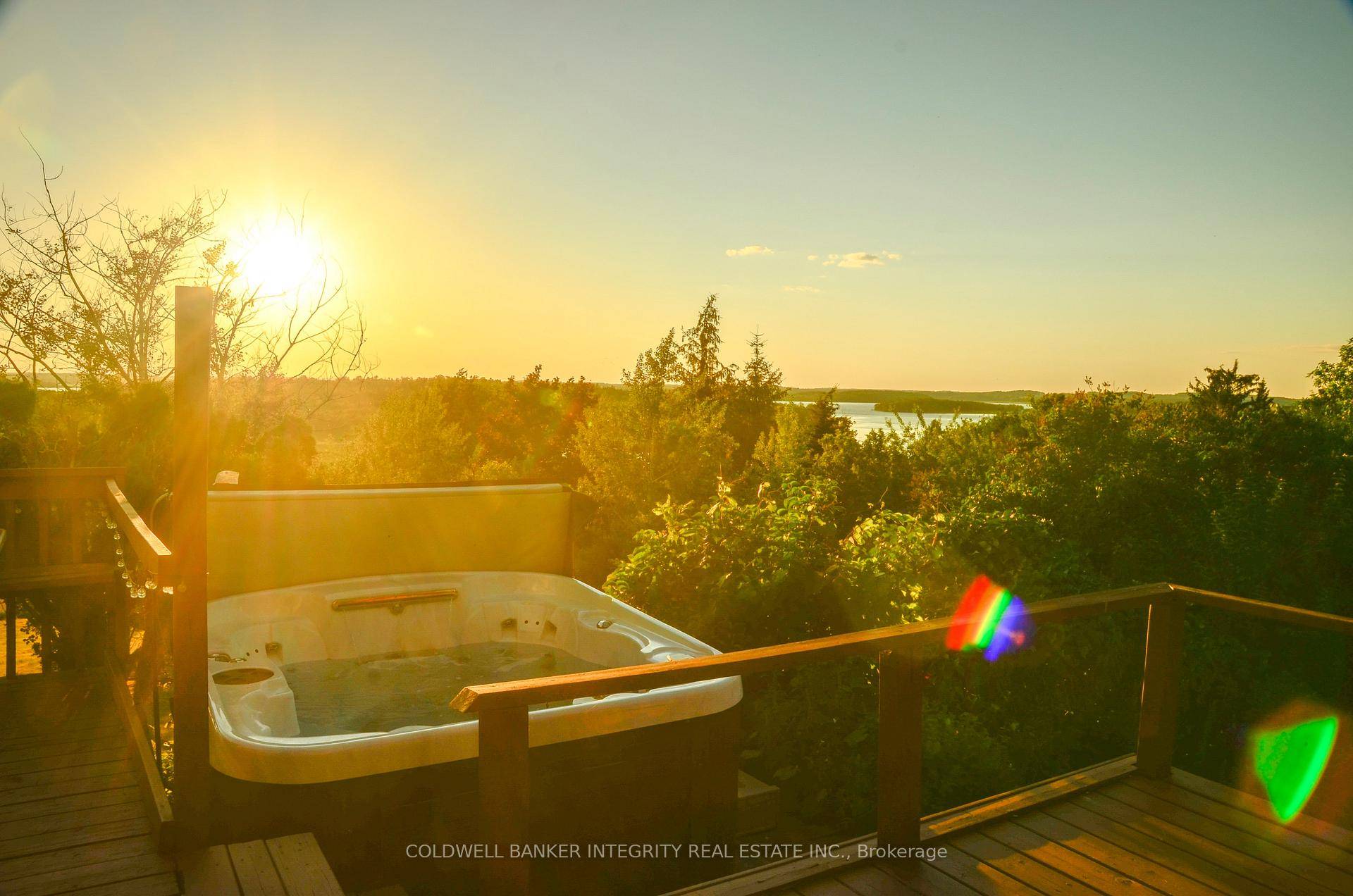 Welcome to Sunset Home a rare, fully winterized 4 season property next to beautiful Rice Lake !
