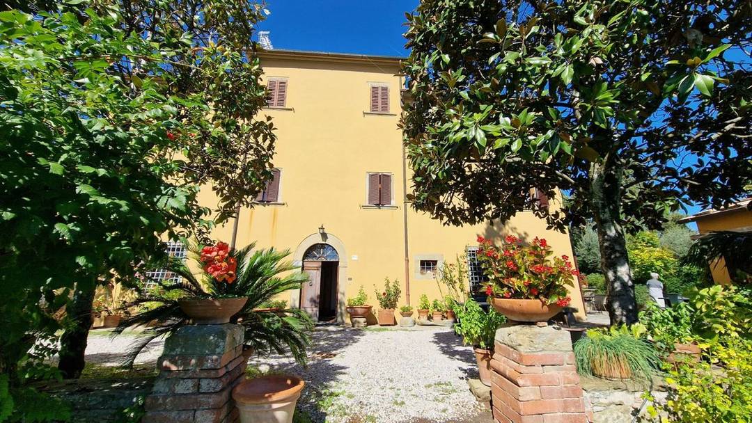 Near the center of the Tuscan village of Monte San Savino, a historic villa with garden, lemon house, garage and chapel is for sale