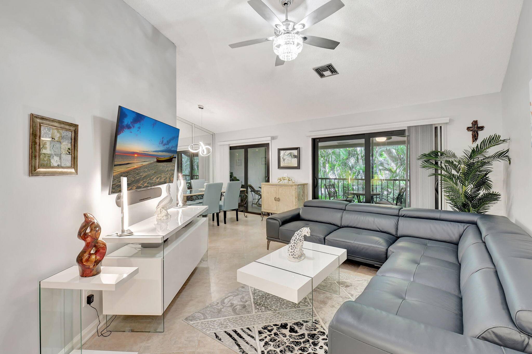 Priced to sell ! Beautifully renovated second floor residence boasting a light bright split floorplan with vaulted ceiling and impact doors windows.
