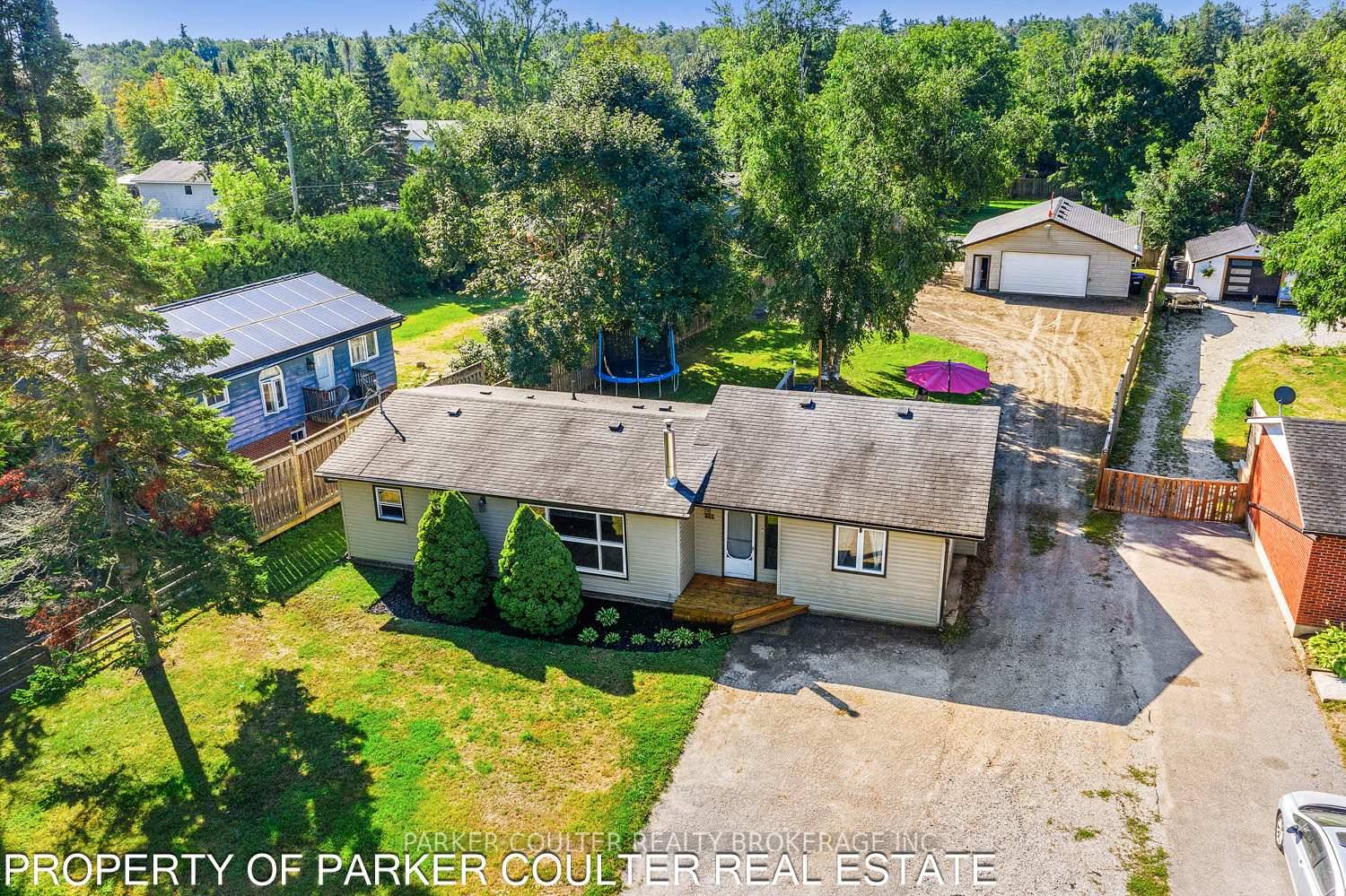 Move in Ready Bungalow with Detached Heated Shop on a Spacious Lot.