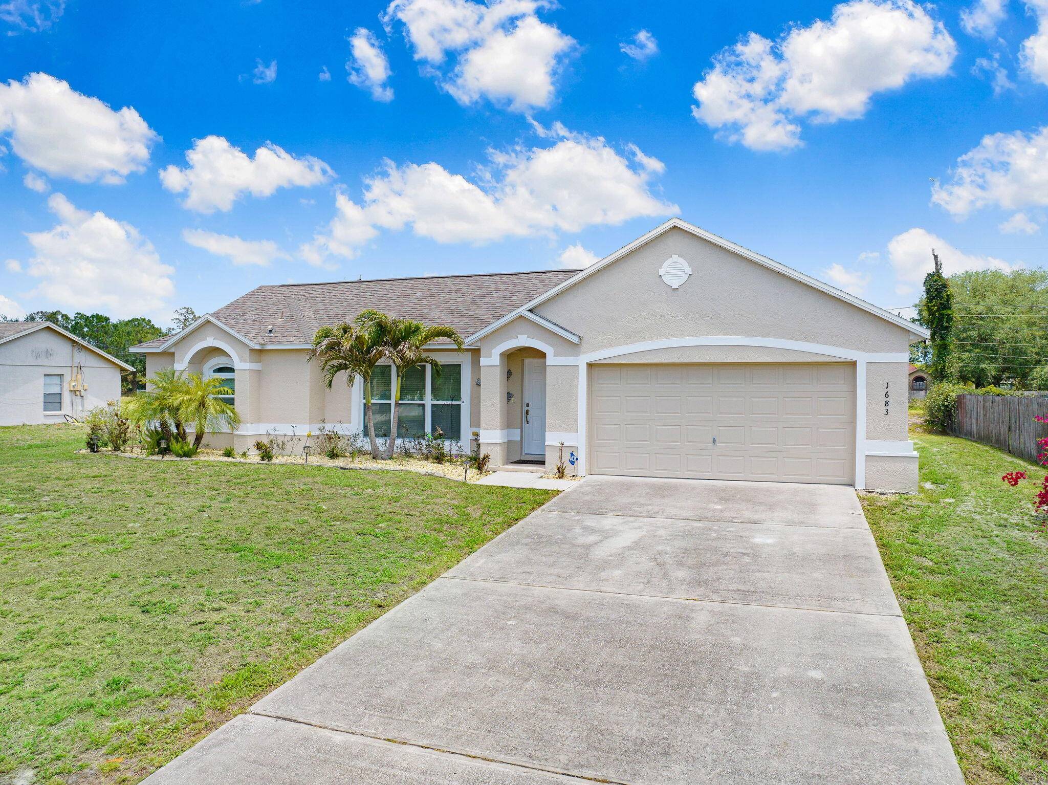 Beautifully Renovated Concrete Block Home with Impact Glass and a 1 year home warranty !
