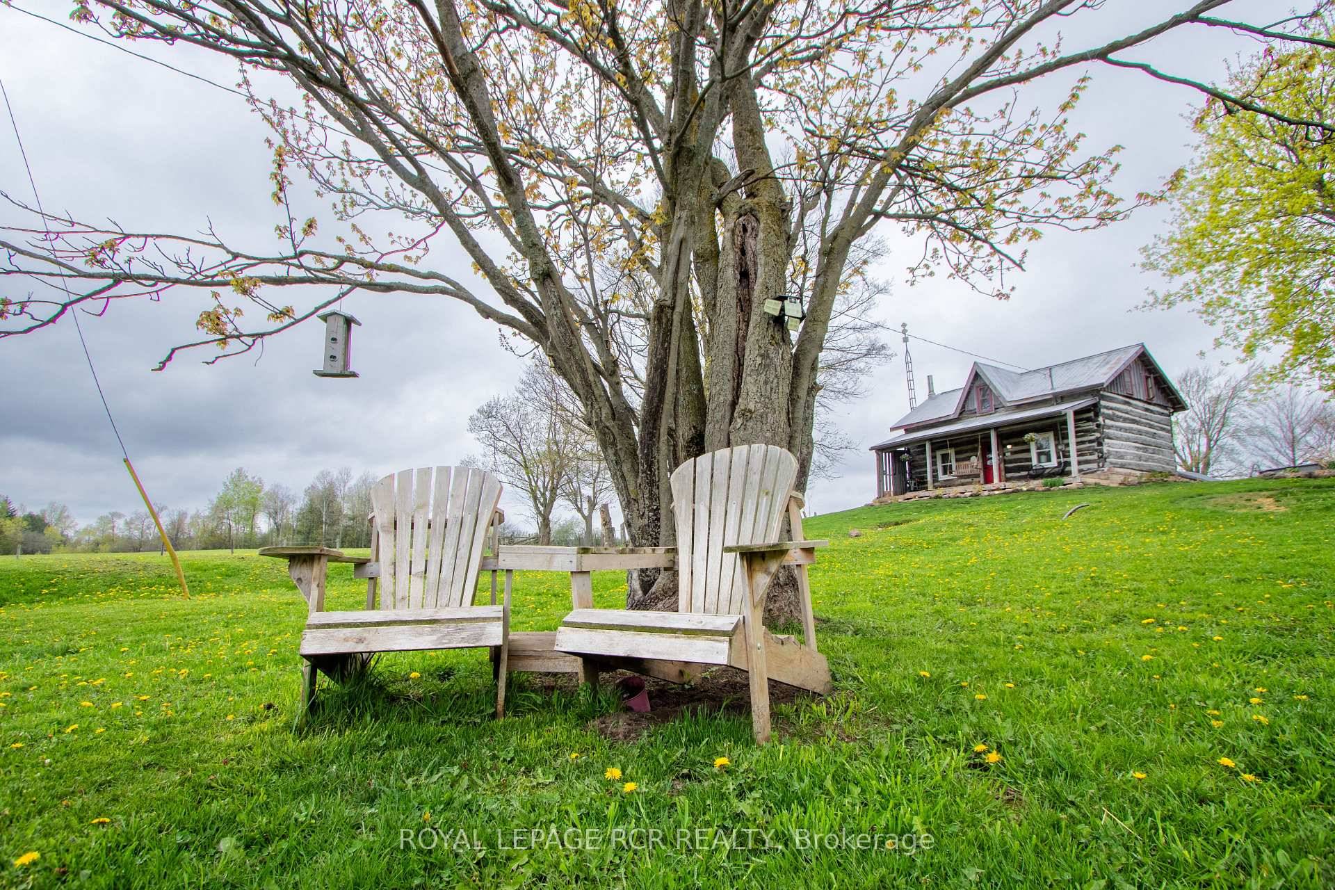 Discover your dream of countryside living with this charming, solid log home located at 125795 Southgate Rd 12.