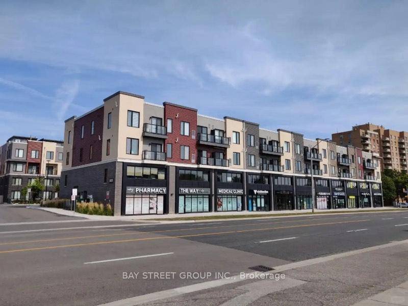 Stunning Condo Unit Showcases Modern Finishes Featuring A Full Sized Kitchen With Quartz Countertops, Stainless Steel Appliances, And A Stylish Subway Tile Backsplash.