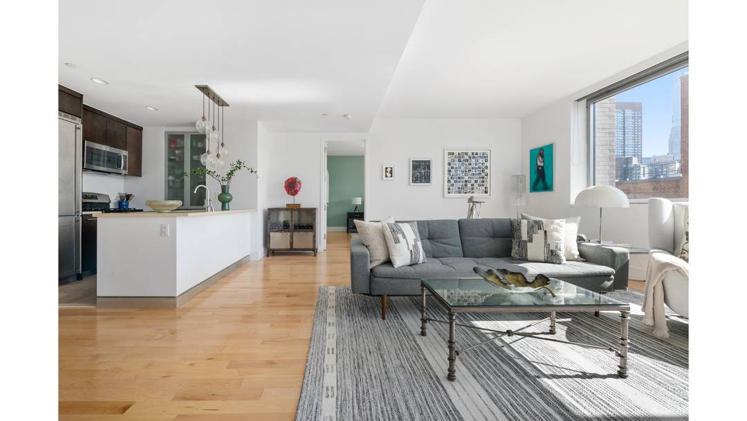 Bathed in natural light, this south facing split two bedroom, two bath residence enjoys open city views and a thoughtfully balanced layout designed for both comfortable living and effortless entertaining.