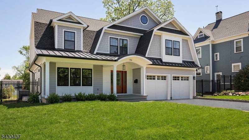 This brand new Dutch Colonial features high end workmanship modern layout.