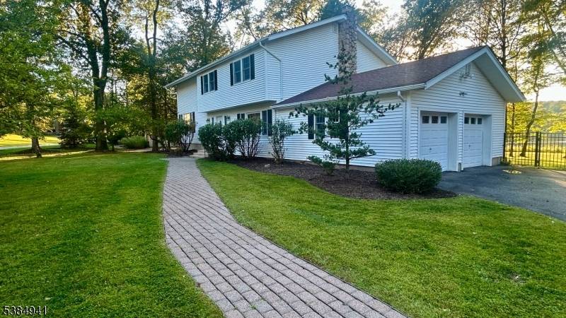 Live the LAKEFRONT staycation lifestyle on one of Shongum Lakes most coveted streets !