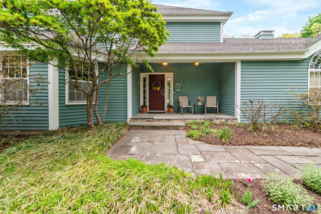 This colonial style home is situated in a desirable Southbury neighborhood, offering four bedrooms and two and a half bathrooms on a spacious, flat lot that borders a wildlife area.