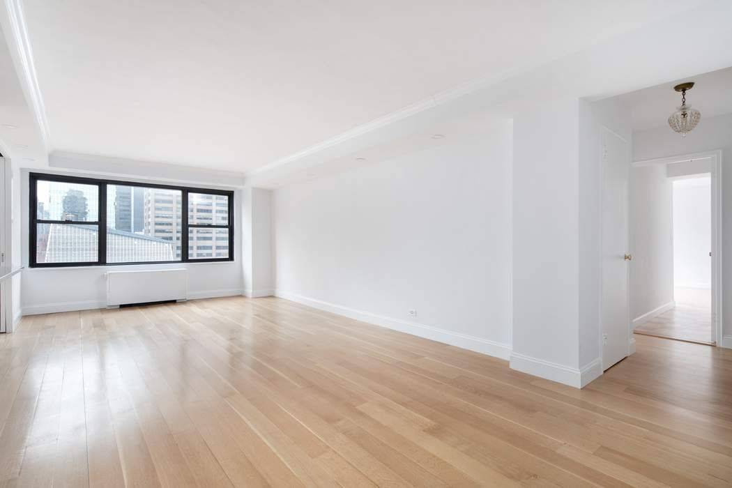 Located on the 19th floor, this beautifully renovated 3 Bedroom and 2 Bath apartment is flooded with southern light.