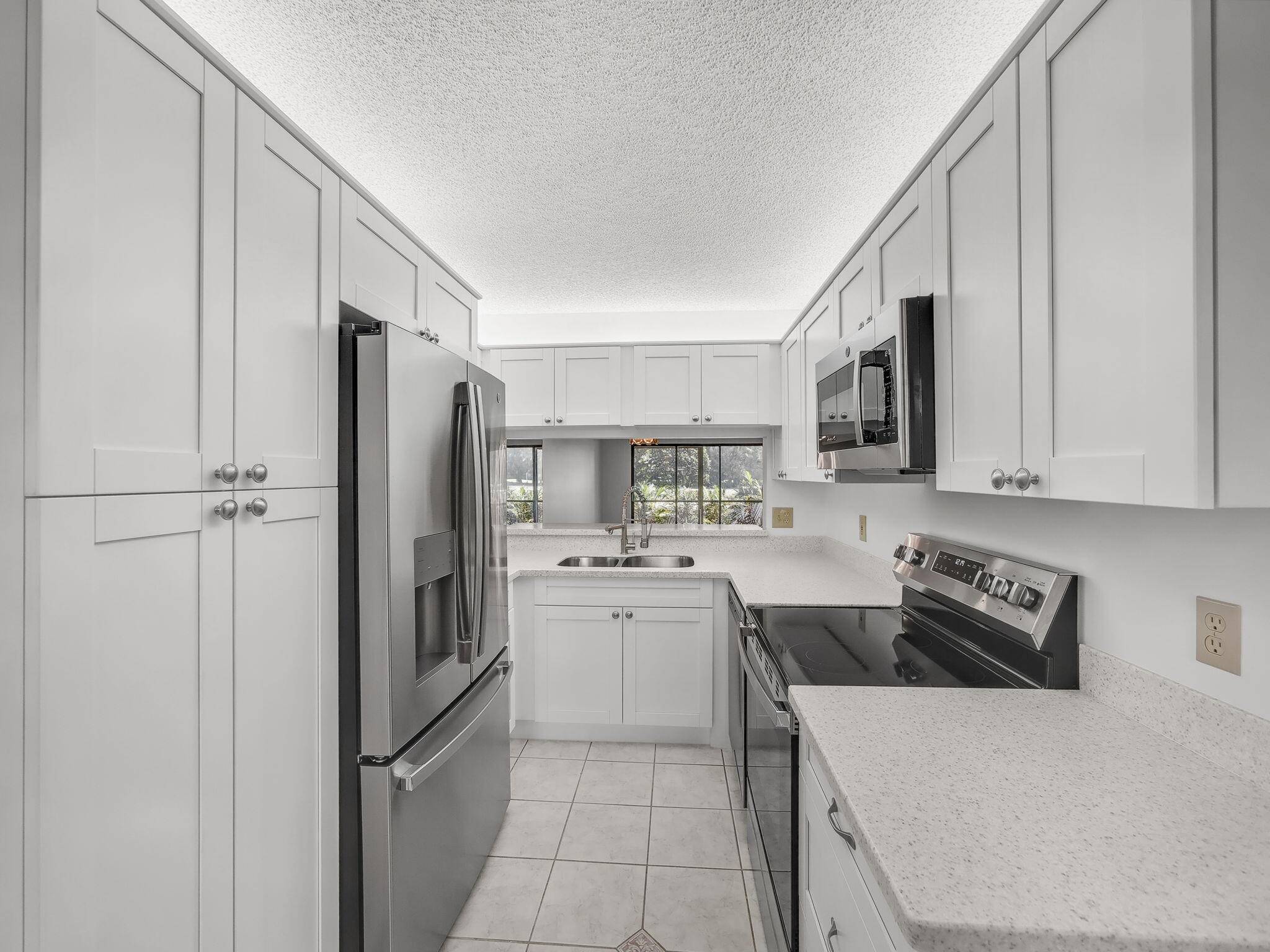 Rarely Available First Floor End Unit with views of the 7th hole fairway and green !