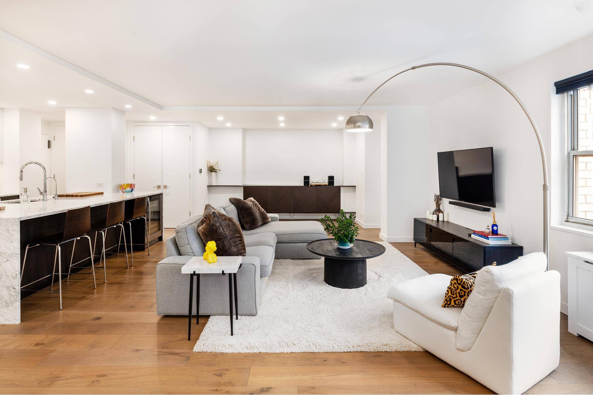 Discover this stunning, sun drenched, east facing, two bedroom, two bathroom co op apartment at the prestigious 201 East 66th Street.