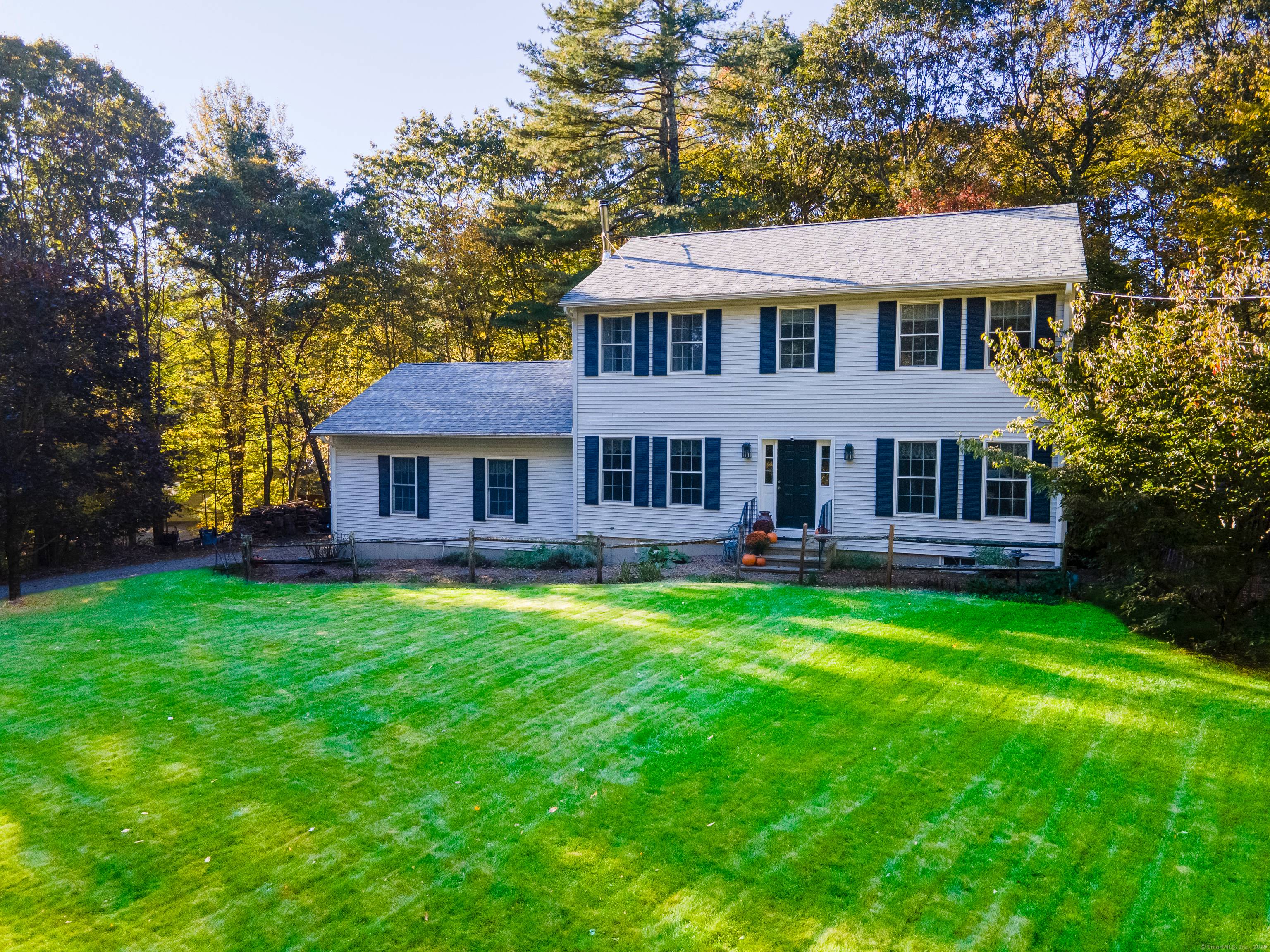 Welcome home to this classic Colonial nestled on a 2 acre country lot in desirable Woodstock !