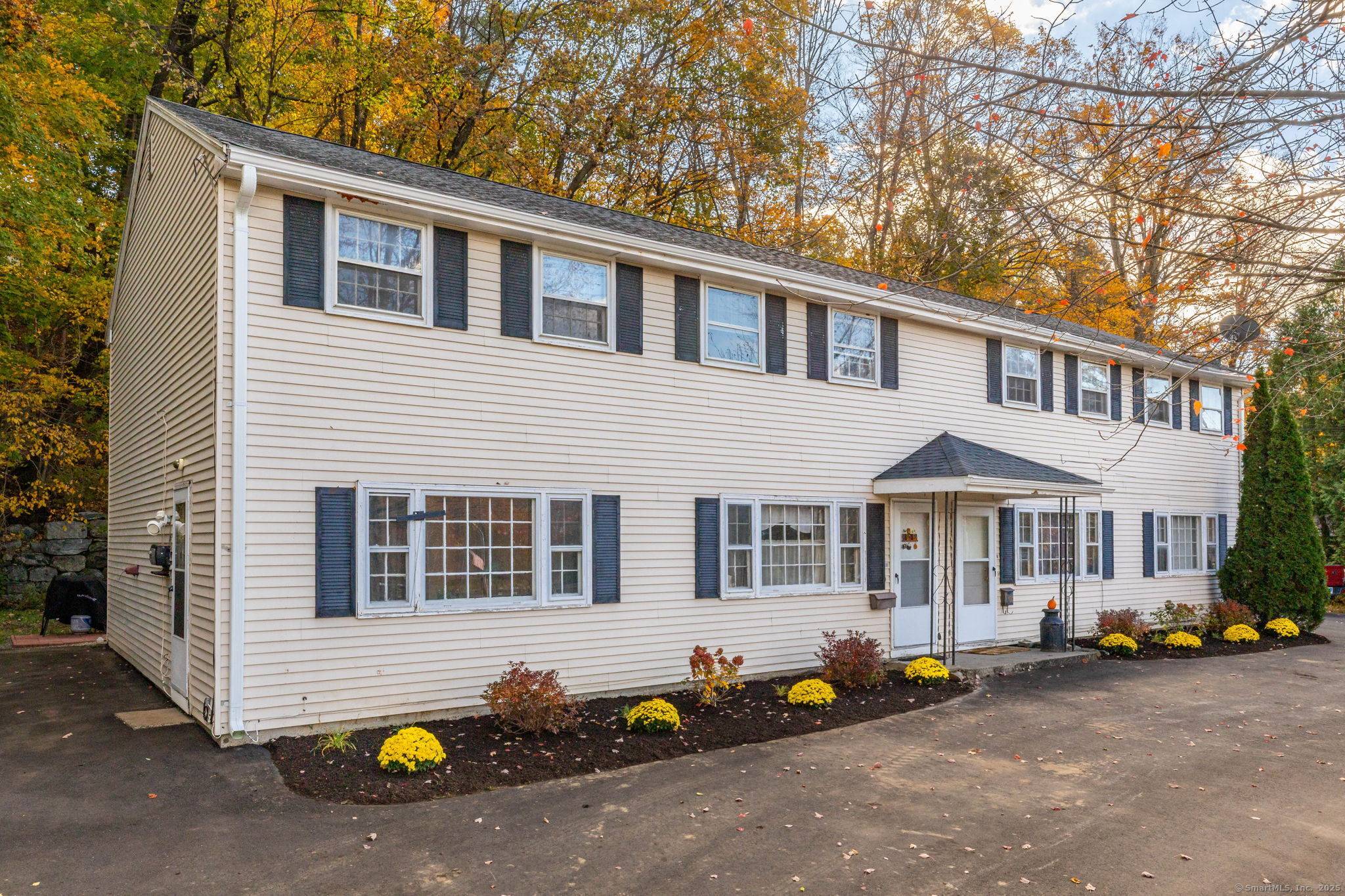 Income Producing Four Family Home with Scenic Farmington River Views in Collinsville.