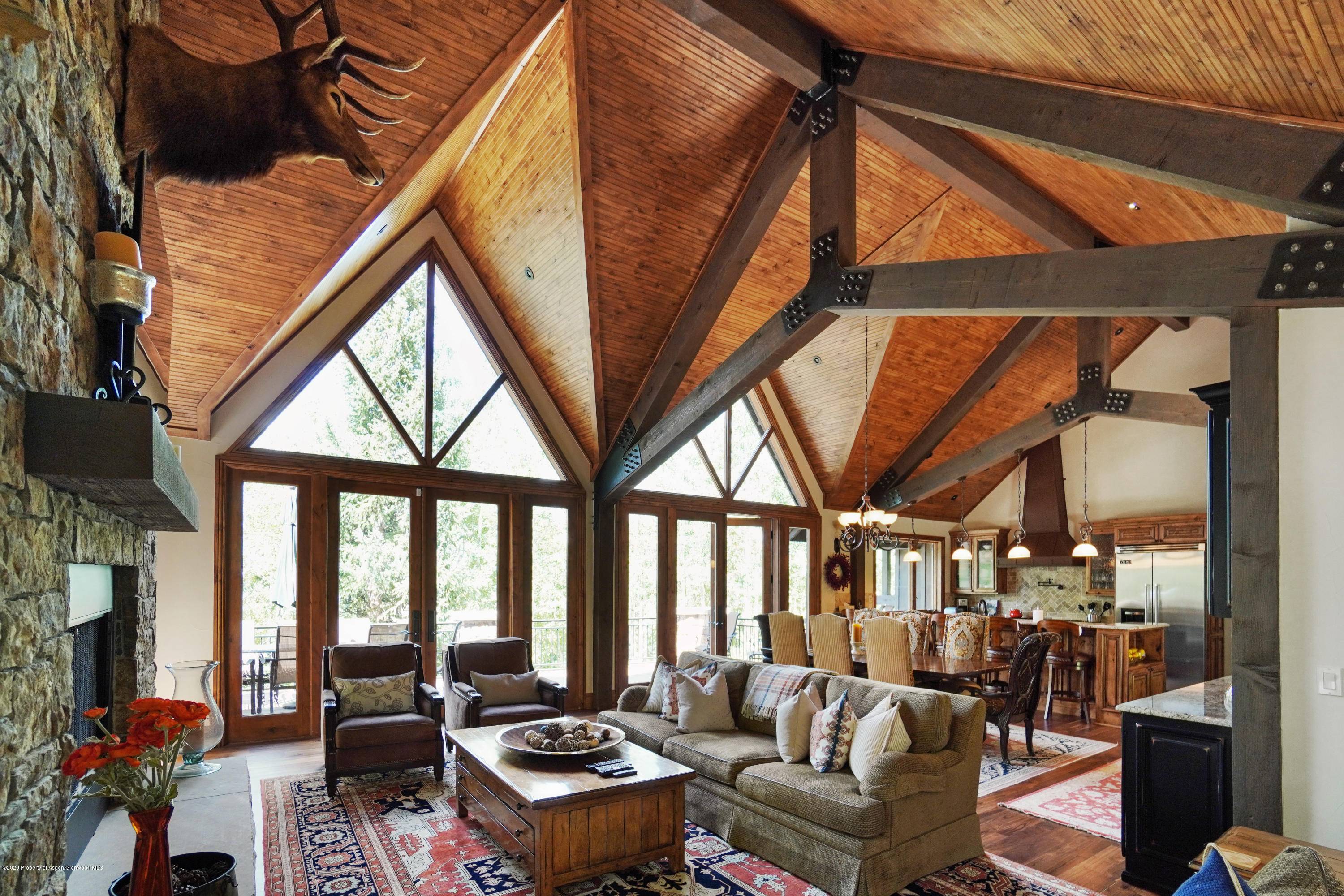 Welcome to a modern farmhouse located in the heart of Wood Run a coveted neighborhood in Snowmass for its ski access and views.