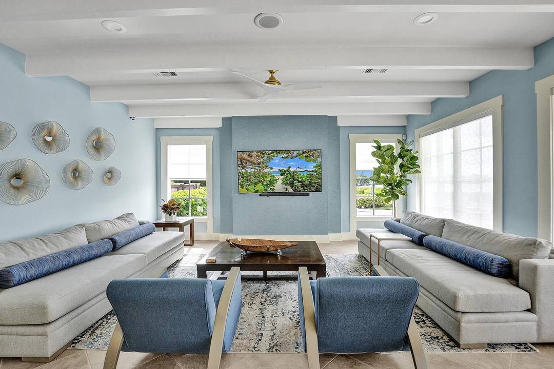 Experience the ultimate coastal LIFESTYLE this winter in this stunning, fully furnished waterfront condo located in an exclusive gated community in Highland Beach.