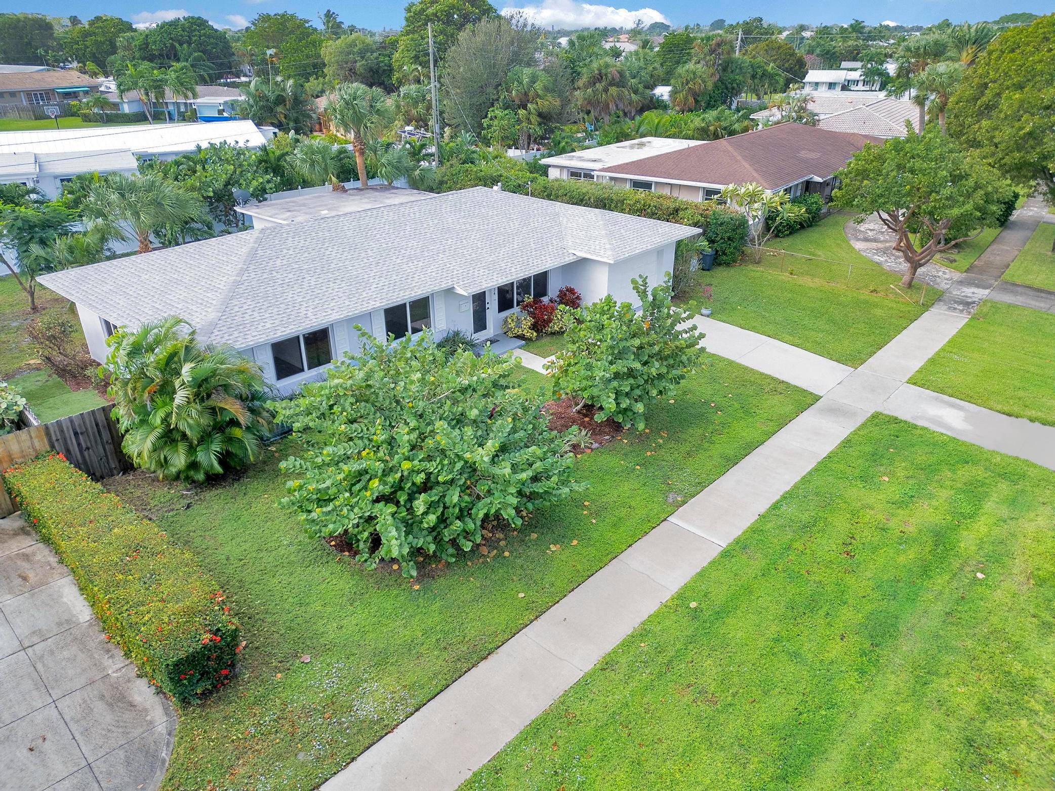 Welcome to this beautifully updated 3 bed, 2 bath gem with a 1 car garage in the sought after Village of North Palm Beach No HOA !