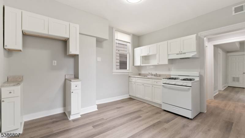 Recently renovated legal 3 family home in Paterson !