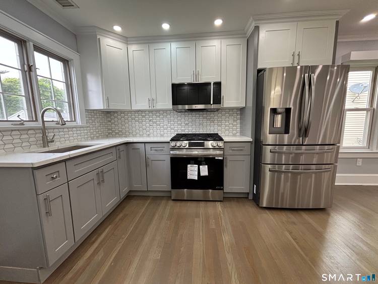 Move in ready, fully renovated 4 bedroom rental featuring a bright, open floor plan and a brand new granite kitchen with a center island.
