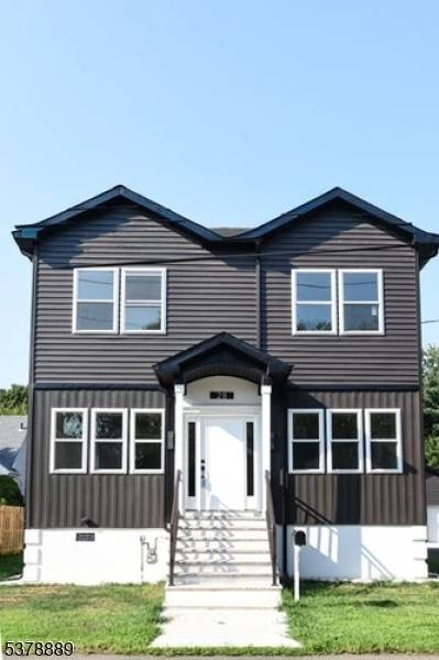 This stunning custom home, completed in 2025, seamlessly blends luxury and modern design, featuring an open concept layout that invites natural light into every corner.