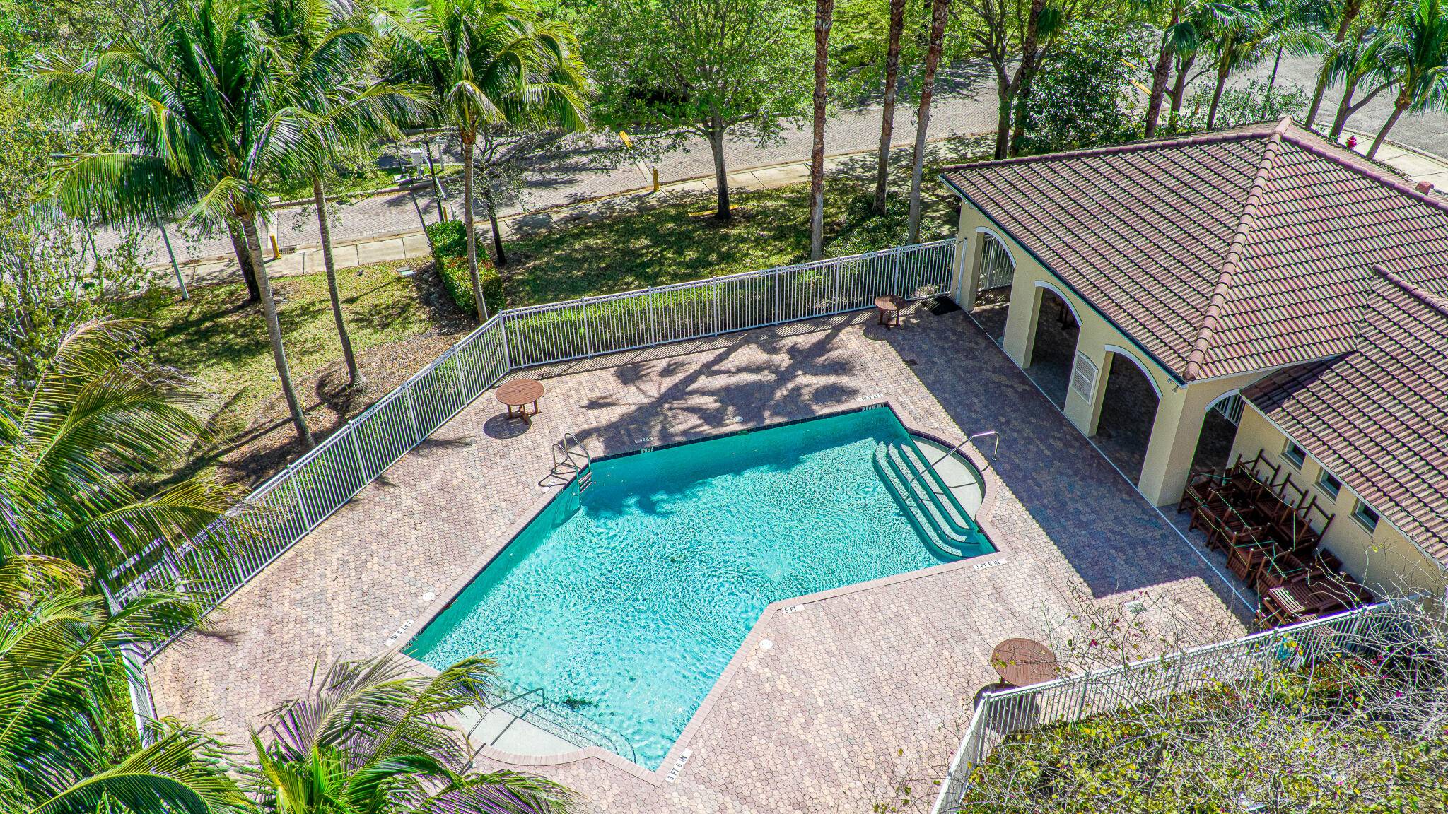 INVESTOR PET FRIENDLY ! Discover refined living in this light filled second floor end unit in the gated Vilabella community.