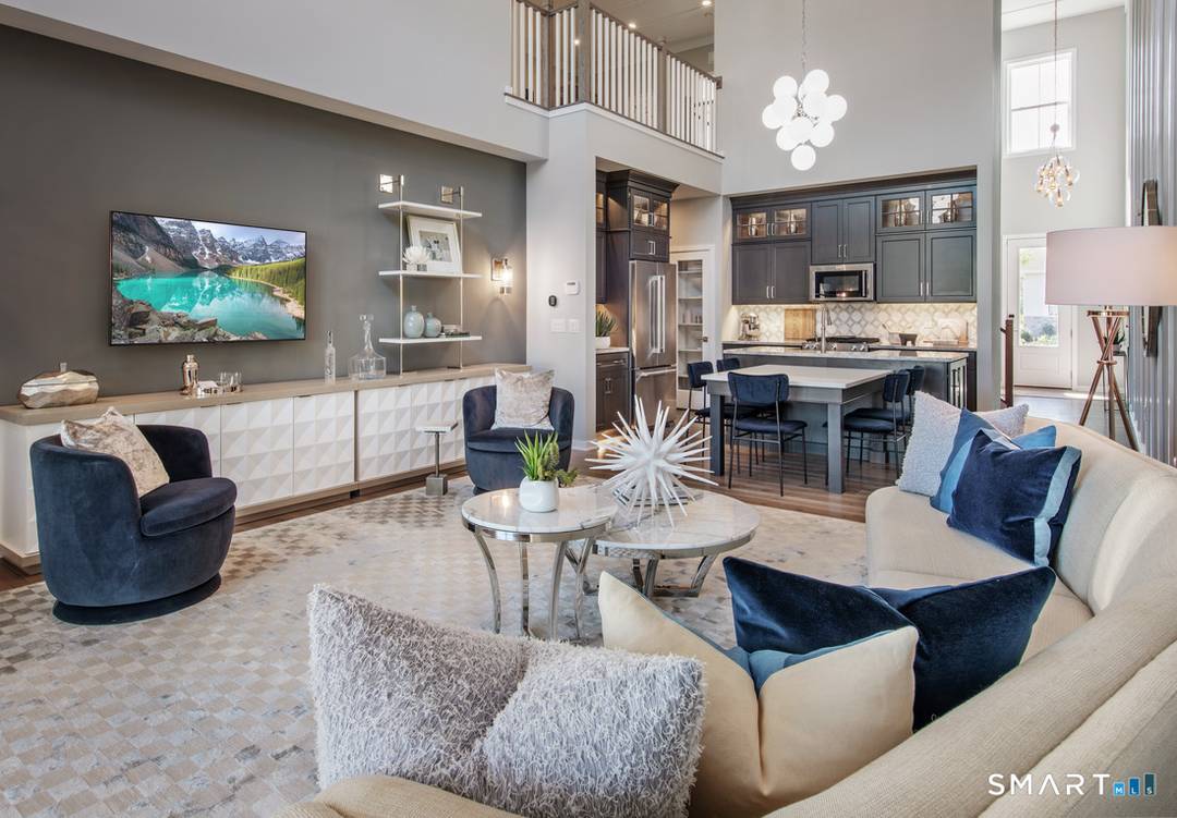 This is the Pierpont Elite Modern Farmhouse a two story townhome with primary bedroom on the main floor and two bedrooms up and a loft.