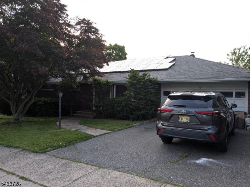 Rare Brick Ranch with very large rooms and park like yard.