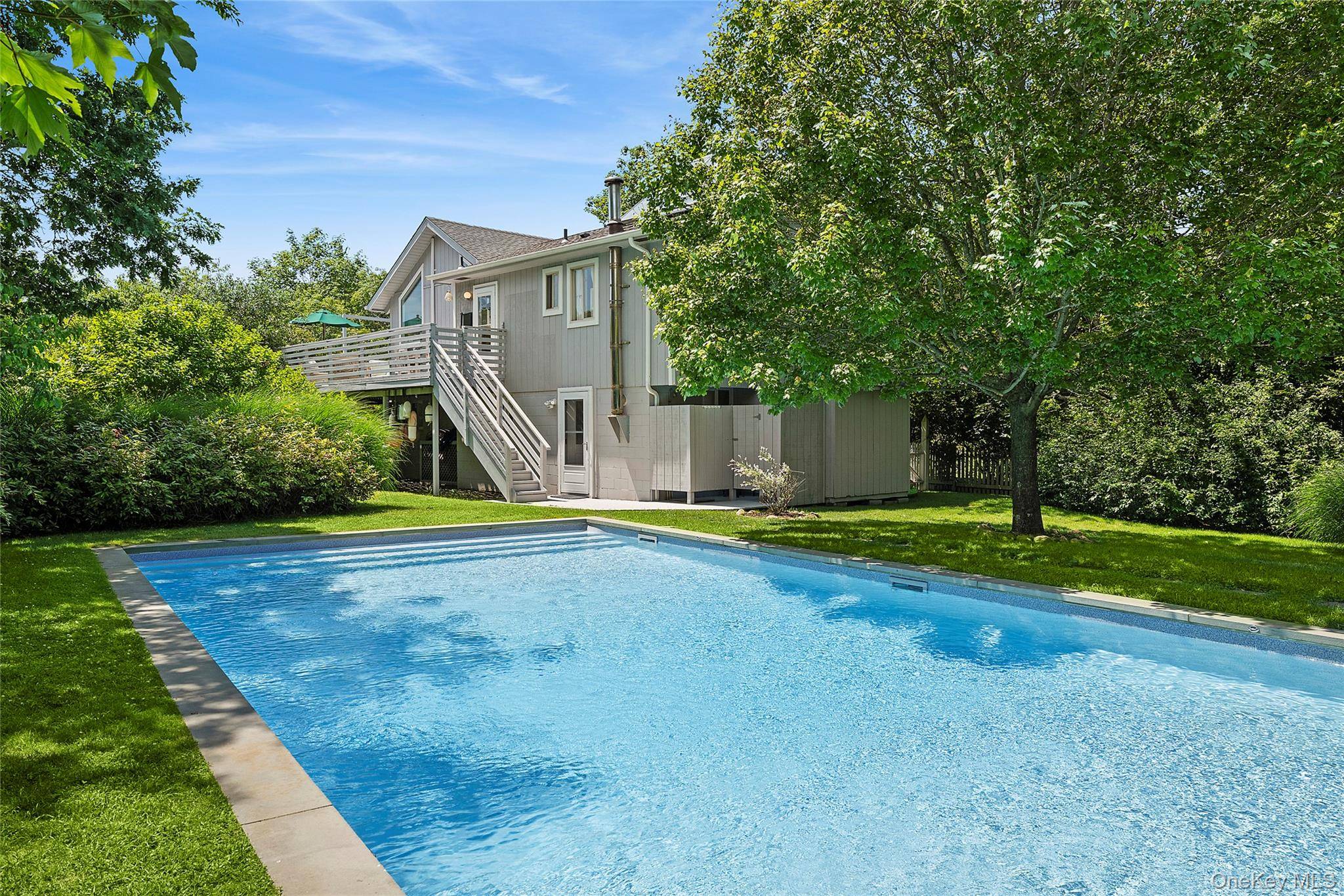 Welcome to 148 Monroe Drive, an idyllic retreat nestled in the scenic Hither Hills of Montauk, New York.