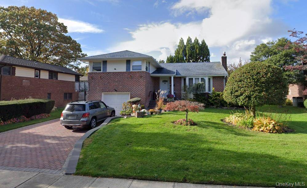 Welcome to this exquisite single family split level home, meticulously renovated in 2018 and nestled within Jericho School District.