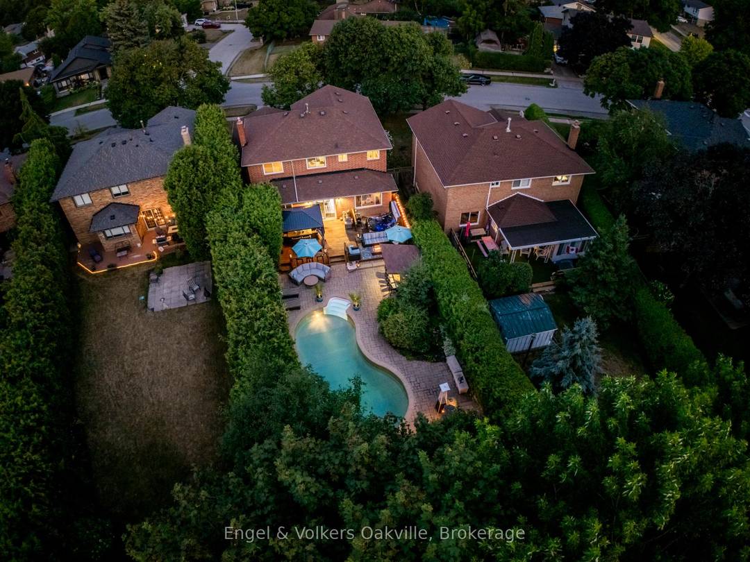 Welcome to an exceptionally rare find in Falgarwood, featuring an approximately 200 foot deep lot that creates a truly private sanctuary.