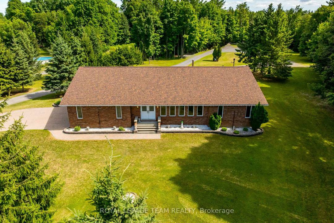 Custom 2, 541 Sq Ft All Brick Bungalow above grade, on a nearly 2 acres property perfect for Contractors amp ; Entertainers alike !