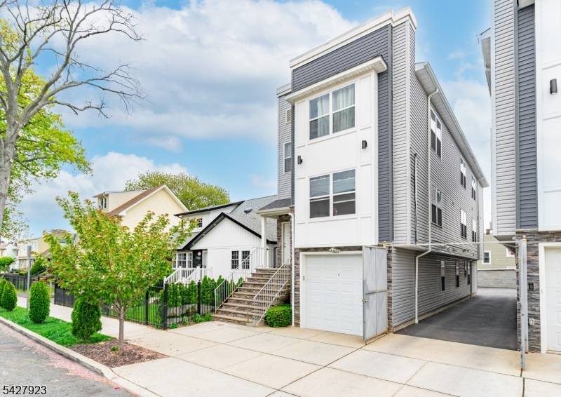 NEWLY BUILT, UNIQUE two family featuring a rare ground level unit with 2 rooms and a full bath, home office, or added flexibility.